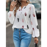 Céline | Blouse Fluide à Motif Plumes